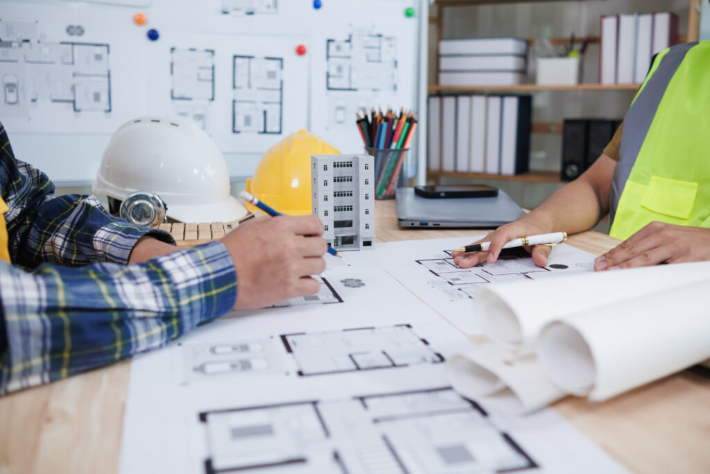 engineering is currently discussing structural design issues with architects to review plans to suit construction and stability of building. concept joint consultation between engineers and architects